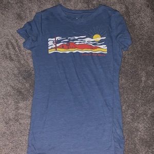 blue shirt with a picture of a sunset!